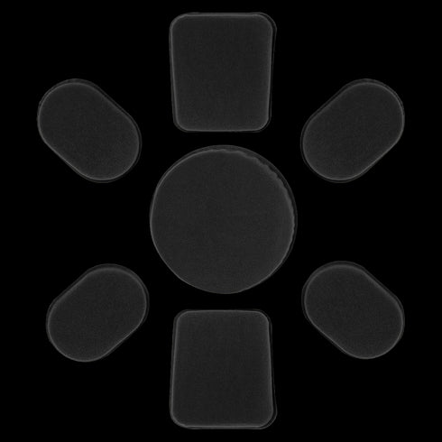 Seven black Condor Helmet Pads II in various shapes are arranged in a circle on a white background, with one large circular pad in the center surrounded by six rectangular pads.